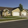 Twin home with attached two-car garage and front lawn